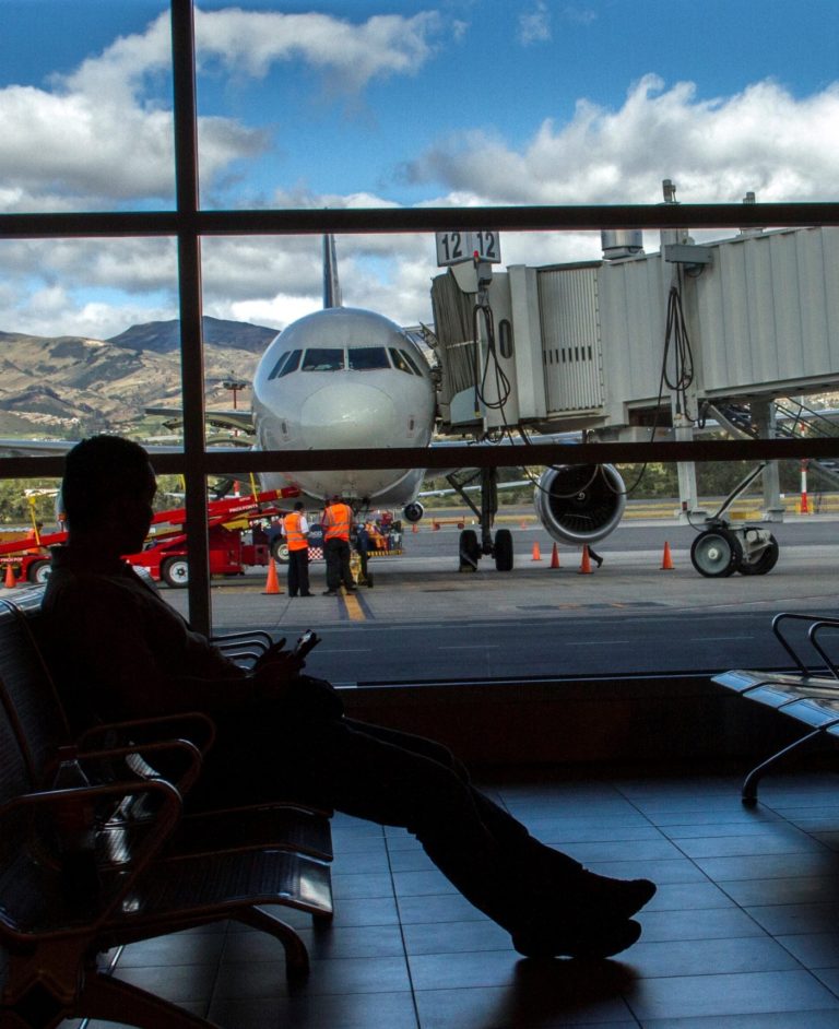 Man sitting in the waiting area inside the airport